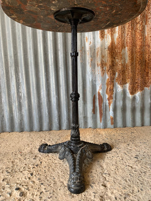 A black cast iron bistro table with red Palladion granite top - small (two available)