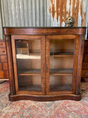 A Victorian double fronted serpentine pier cabinet