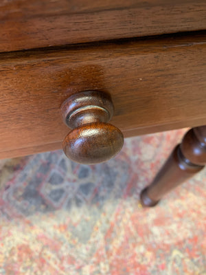 A Victorian mahogany writing desk with green leather top