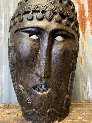 A large wooden carved Oceanian/Australasian tribal mask