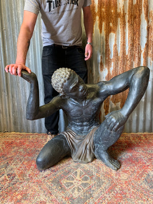 A large bronze blackamoor statue