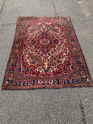 A red ground Heriz Persian rug - 206cm x 145cm