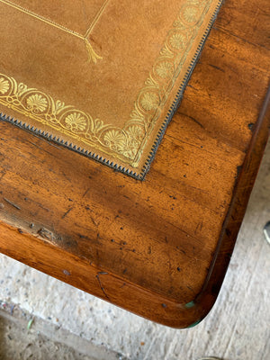 A Victorian tan leather pedestal desk on castors