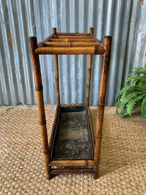 A bamboo stick stand with metal liner