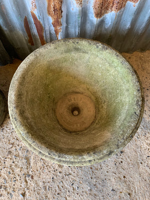 A pair of large round lattice cast stone urns