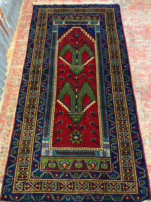 A red ground Persian rectangular rug with niche design - 208cm x 102cm