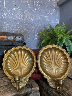 A pair of large brass shell candlestick wall sconces