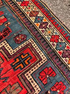 A red blue ground Persian rectangular rug 150cm x 119cm