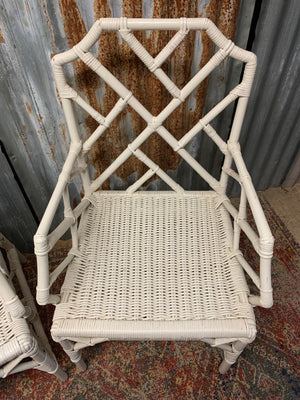 A pair of white faux bamboo Chinese Chippendale chairs