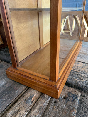 A glass table top shop display cabinet