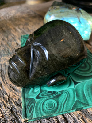 A carved obsidian head