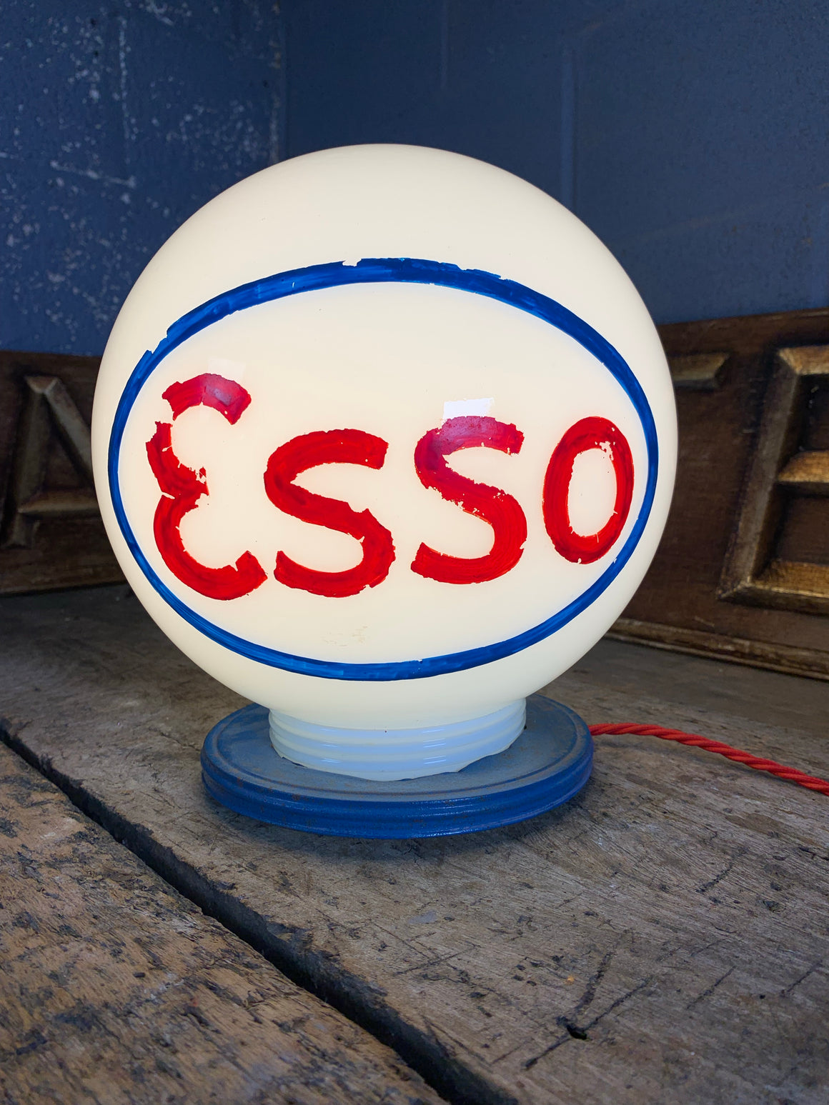 An Esso gas pump globe table lamp