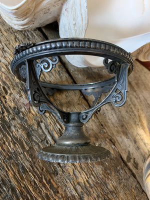 A fortune teller's crystal ball on a silver plated Art Nouveau stand