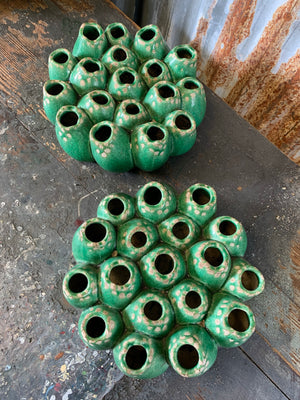 A green studio pottery coral form vase in the style of Pols Potten
