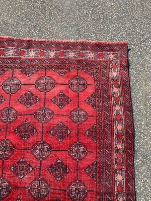 A Persian red ground Bokhara runner - 201 x 118cm