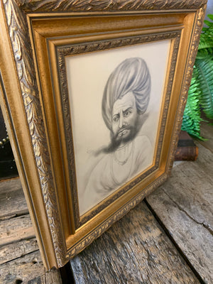 A framed pencil portrait of an Indian Rajasthani gentleman in a turban