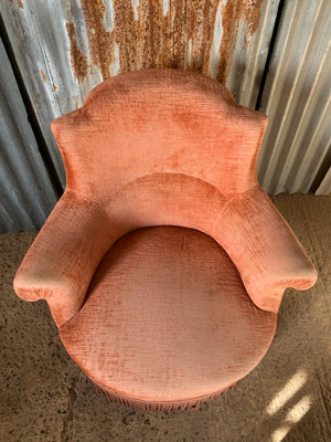 A salmon pink velvet Napoleon III chateau armchair