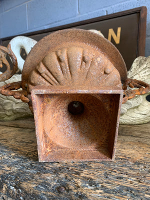 A pair of cast iron urns with handles