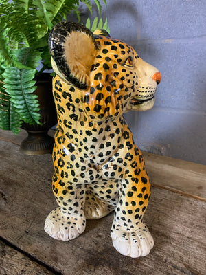 A large Hollywood Regency leopard cub statue