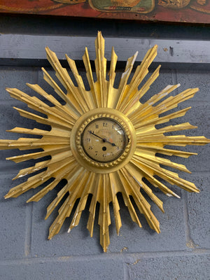 A giltwood sunburst convex wall clock