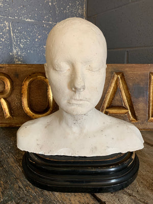 A life size bust in white plaster