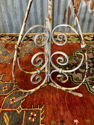 A white cast iron garden wine table or stand