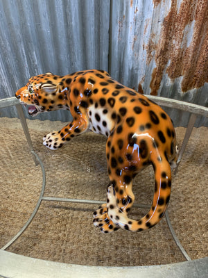 A prowling leopard statue