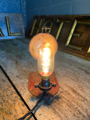 An industrial parabolic reflector lamp