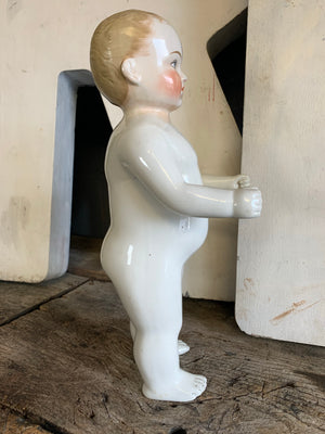 A 19th Century porcelain frozen Charlie doll