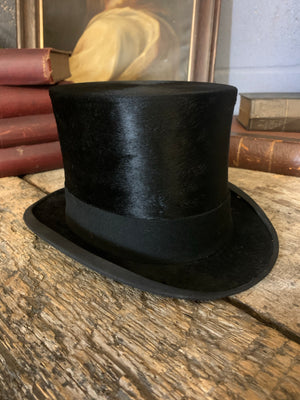 A silk all black top hat by Dunn & Co with its original box