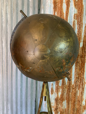 A large vintage industrial style globe drinks bar