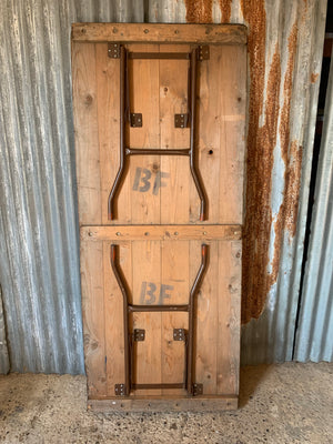 A wooden plank top folding trestle table - Table 2