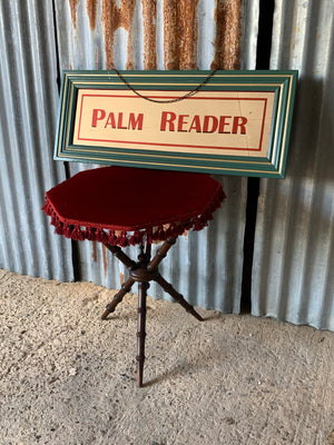 A large Palm Reader fairground mirror