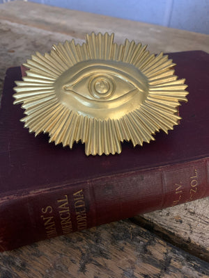 A large Masonic "All Seeing Eye" plaque