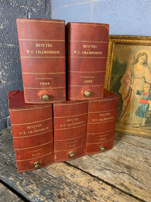 A set of five red leather and brass book boxes