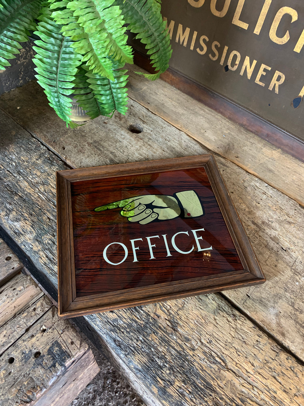 A reverse painted "Office" sign
