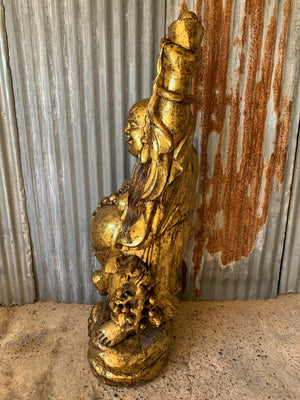 A very large carved wooden gilded laughing Buddha