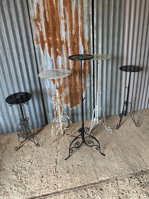 A black metal garden wine table or stand