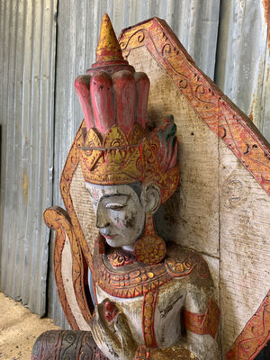 A large carved wooden Brahma figure