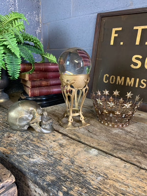 A fortune teller's crystal ball on a gold Art Nouveau stand