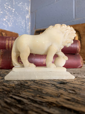 An opposing pair of Grand Tour alabaster Medici lions