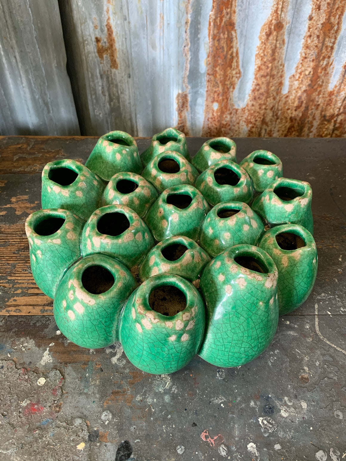 A green studio pottery coral form vase in the style of Pols Potten