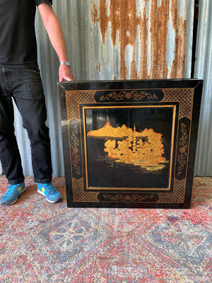 A black lacquered chinoiserie square coffee table