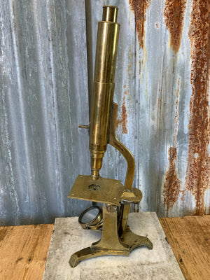 A 19th Century solid brass monocular microscope