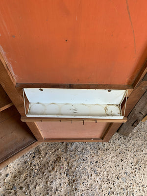 A school cupboard with interior shelving