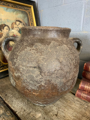 A large terracotta urn with double lug handles ~2