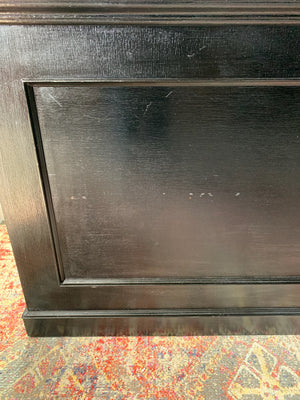 An ebonised shop counter