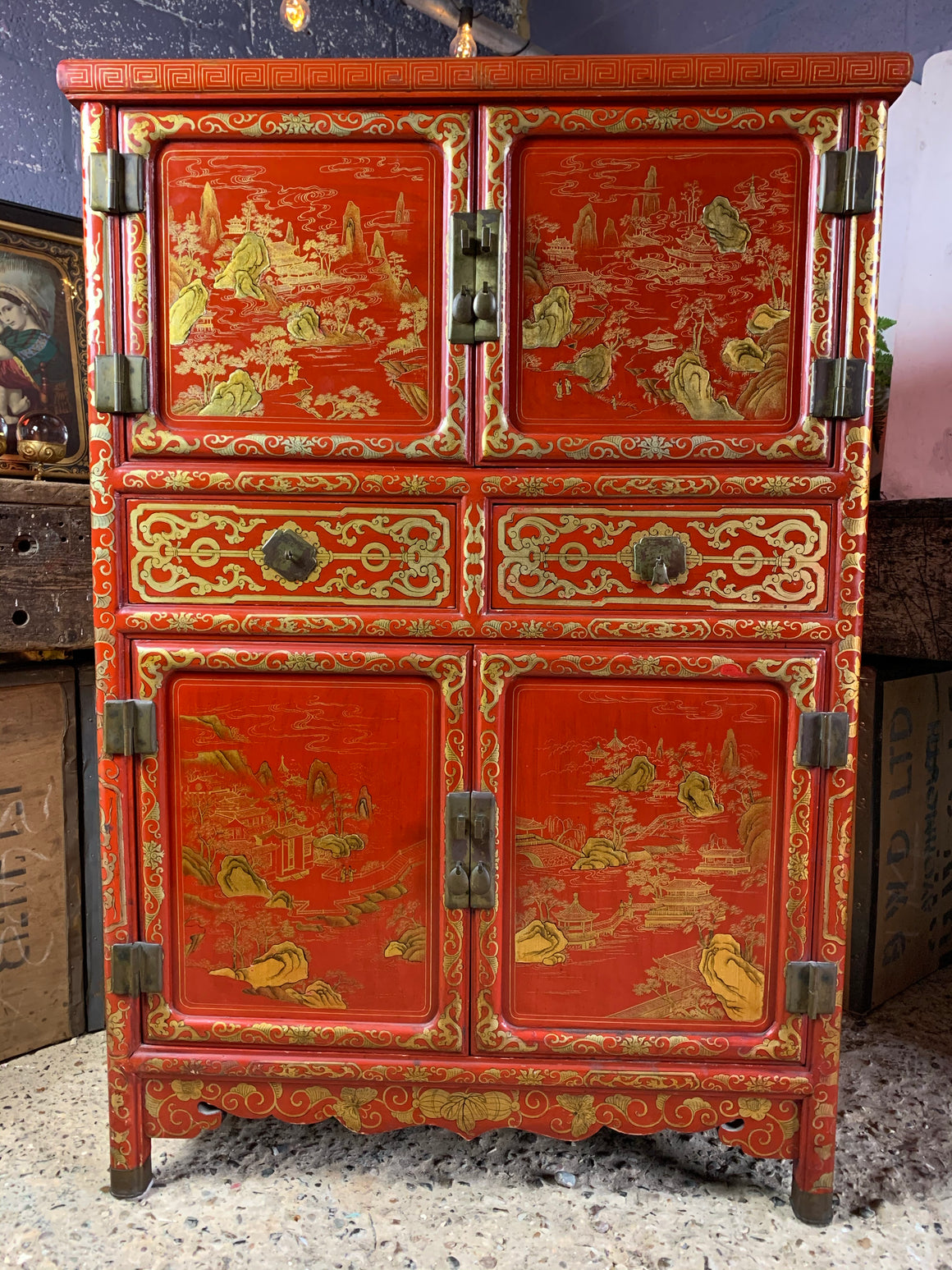 A red and gold lacquer Chinoiserie cabinet