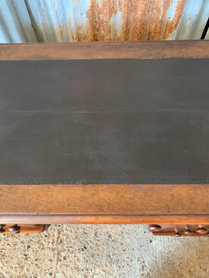 A Victorian mahogany pedestal desk on castors