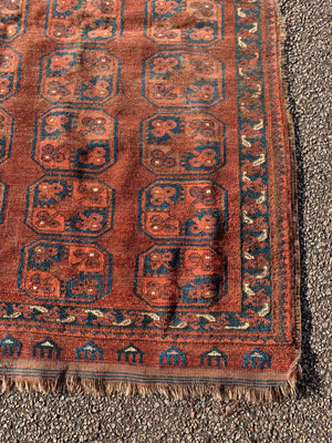 A Persian brown ground rectangular Bokhara rug